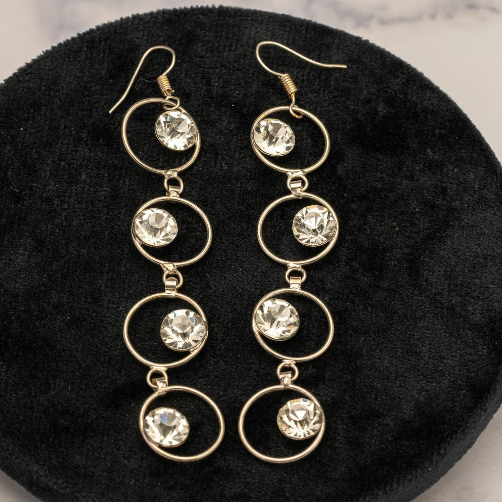 Long decorative hooped rhinestone dangle earrings